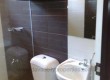 Toilet and bath with fixtures. This is an actual photo of one of the house models at Bambu Estate Subdivision.